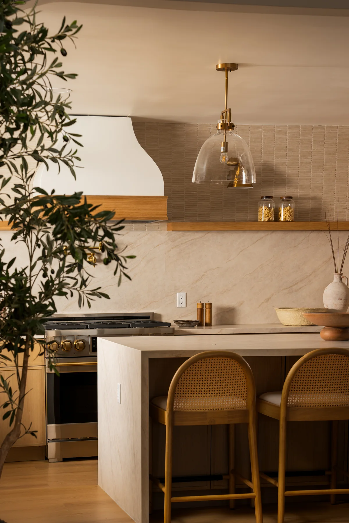 Kitchen island, foliage, and pendant-light detail