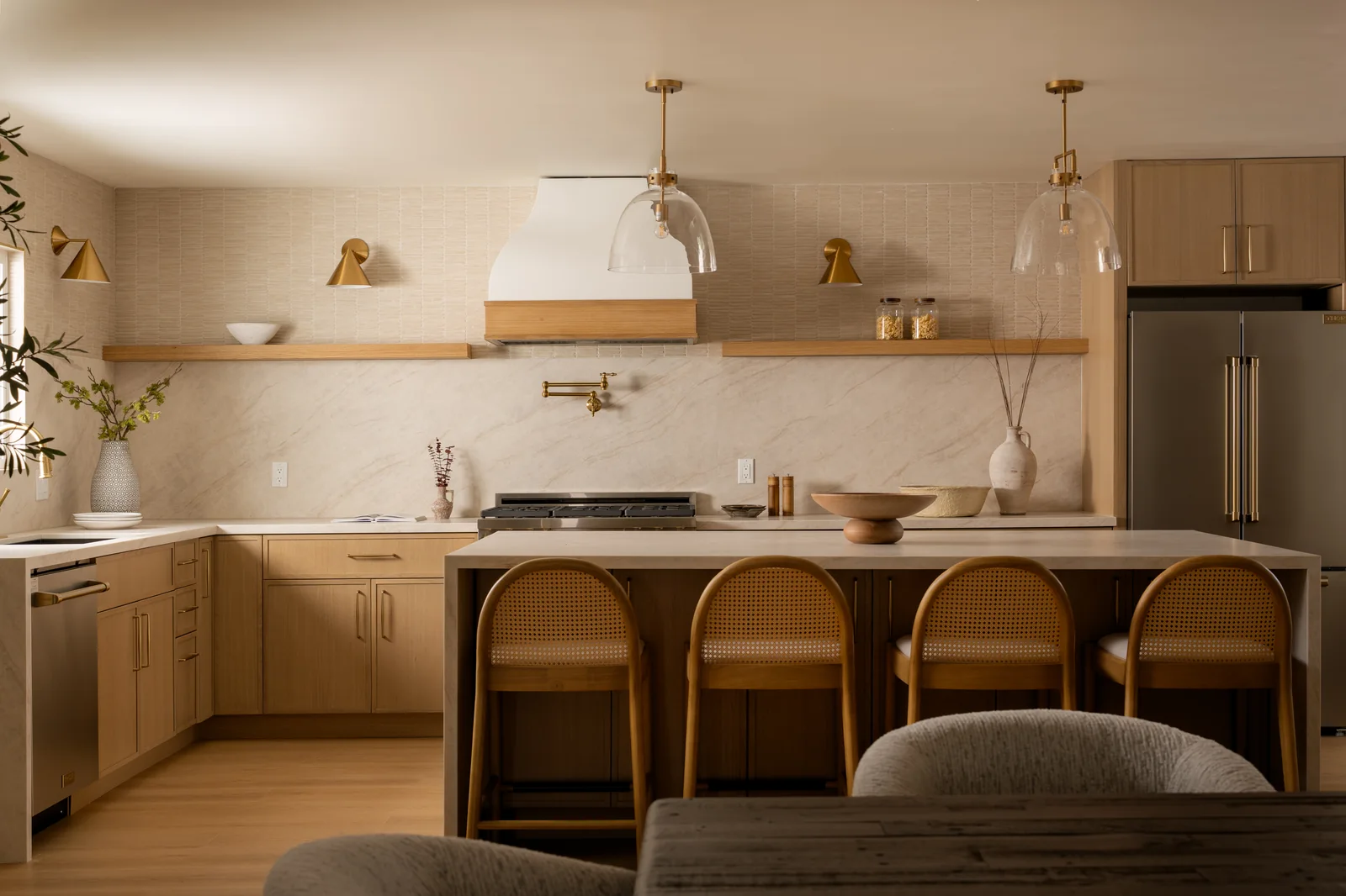 Kitchen with stone surfaces and warm wood cabinetry