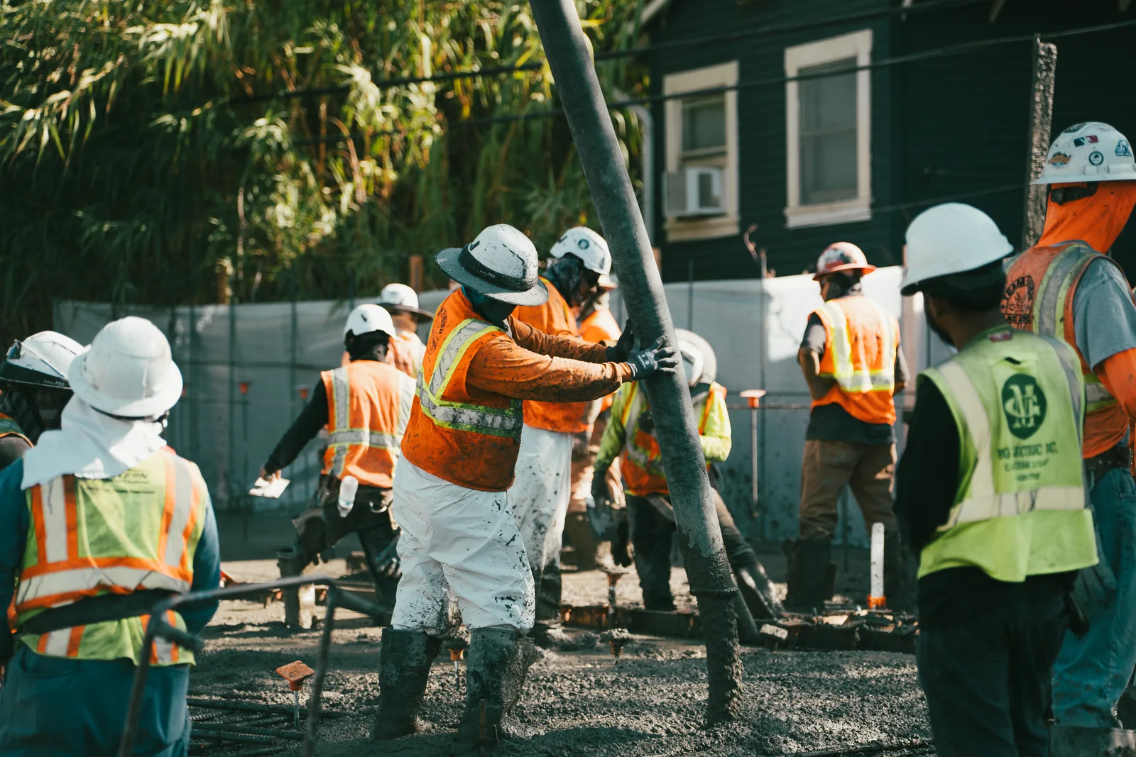 Construction crew coordinating a concrete pour