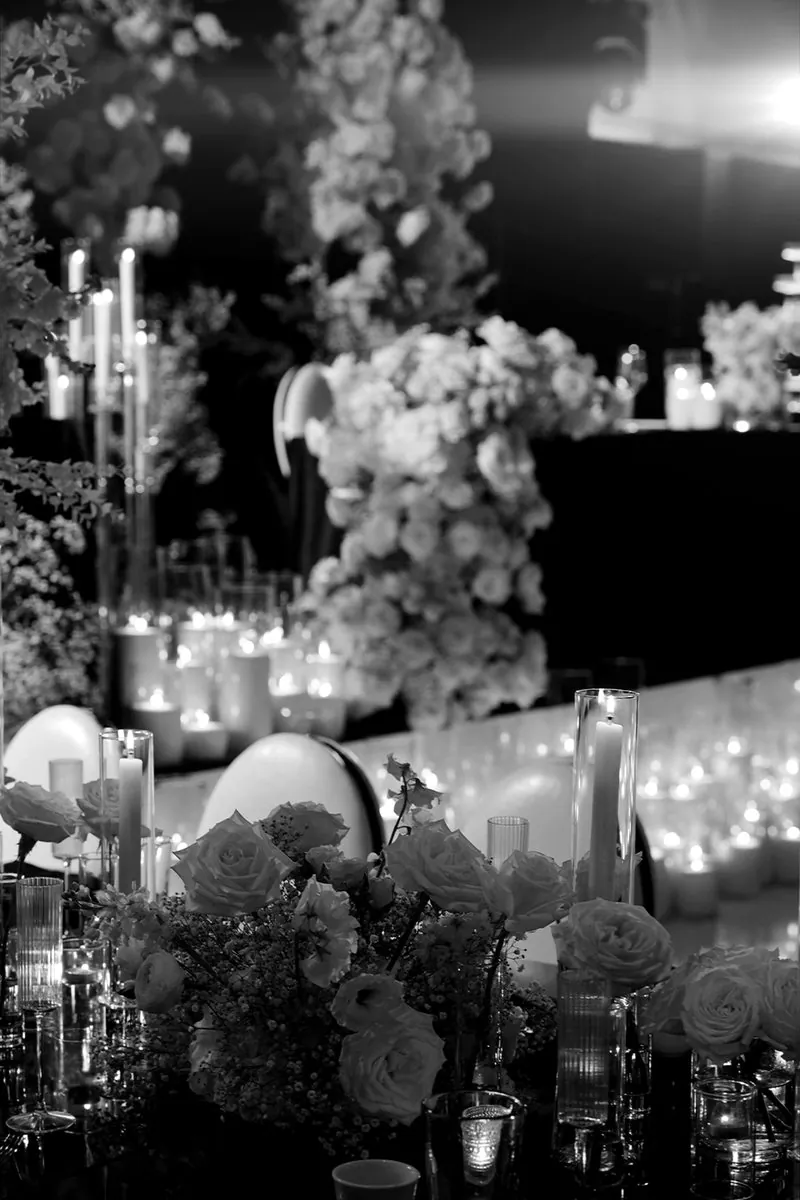 Candlelit reception table with white florals
